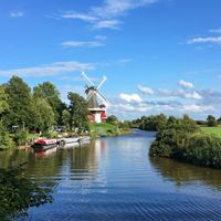 Old Greetsiel sieltief with a windmill in the background