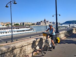 Cyclist in front of Budapest Parliament