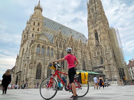 Cyclists in Vienna in front of St. Stephen's Cathedral